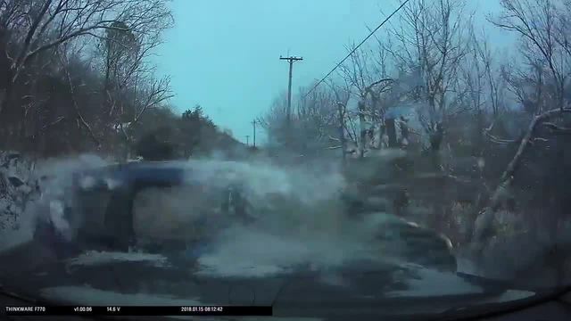 Dash cam catches this auto hitting ice, skidding into police vehicle
